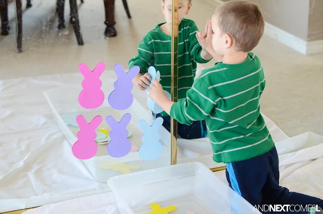 Easter sensory bin for toddlers using water and foam bunny shapes