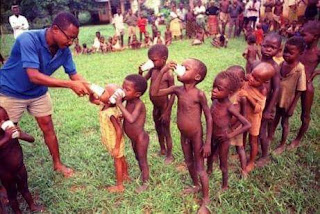 Dr Okonkwo feeding malnourished Biafran children