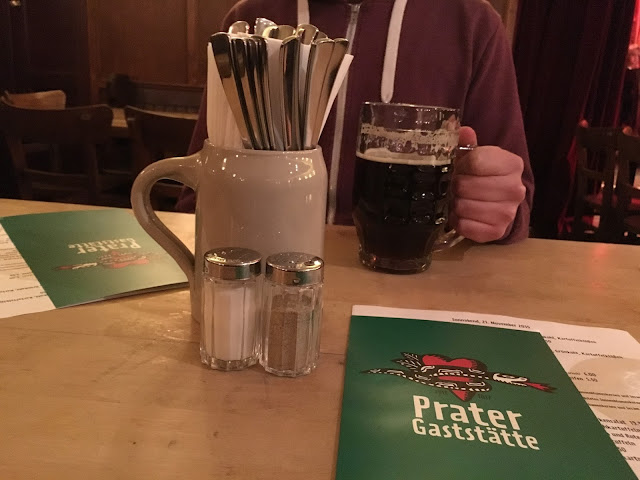Food menus and a pint of beer at prater garden berlin
