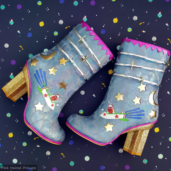 Irregular Choice Luxovious blue space themed boots with gold star heel on dark planet background