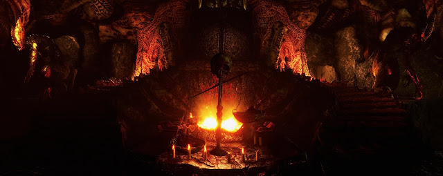 Agony - very dark room with firepit and skull impaled on a pole