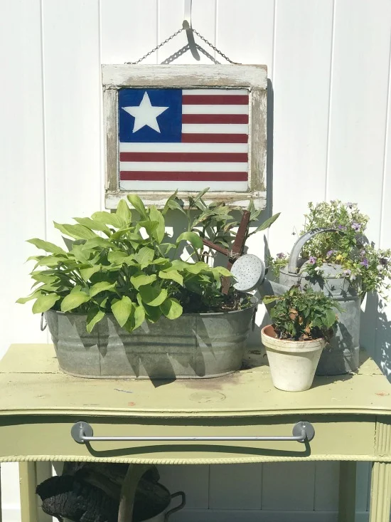 American flag window and plants and potting table