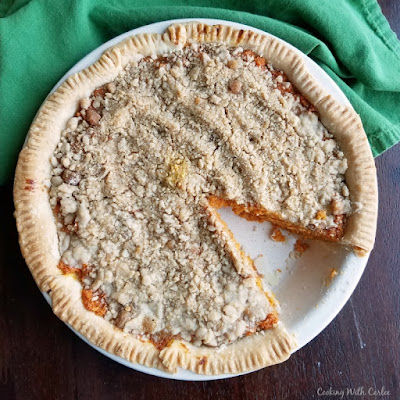 This carrot pie is topped with a buttery cinnamon streusel. It is a fabulous combination that will make you wonder where carrot pie has been your whole life! It's perfect for Easter, Thanksgiving or just because! carrot pie with one slice missing