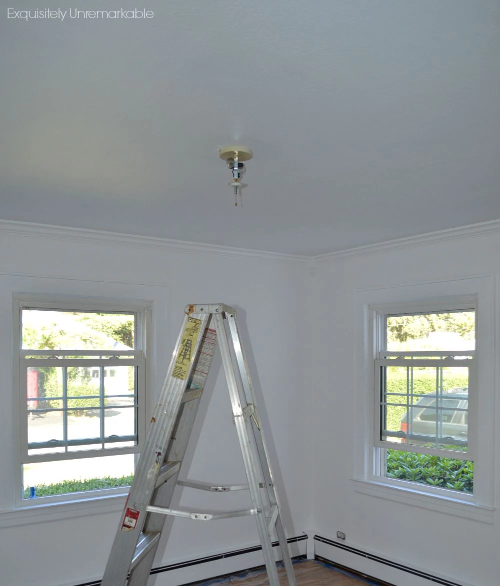 White bedroom under construction and adding moulding