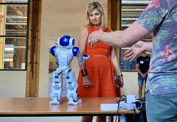 Queen Maxima wore a Natan summer dress in orange. The Queen visited technology facility TechnoHUB in Woerden