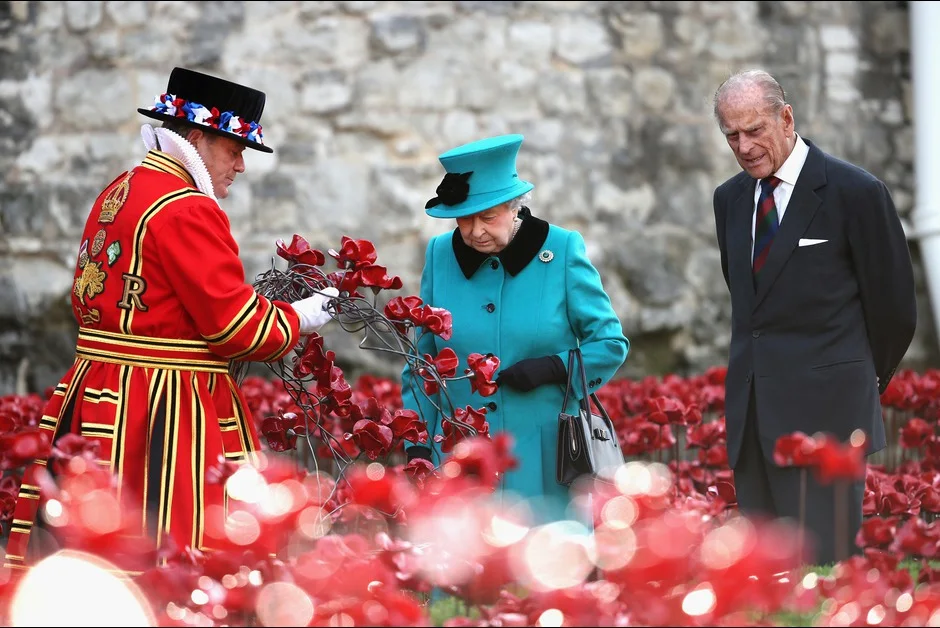 Queen Elizabeth II and Prince Philip, Duke of Edinburgh visit the Blood Swept Lands and Seas of Red evolving art installation at the Tower of London