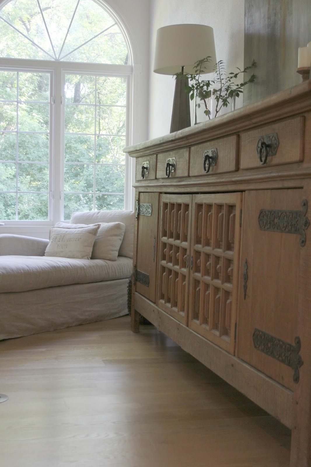 Rustic oak Belgian antique cupboard in European country styled living room by Hello Lovely Studio