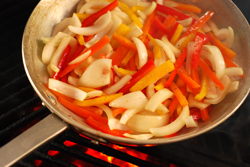 onions and peppers on the grill