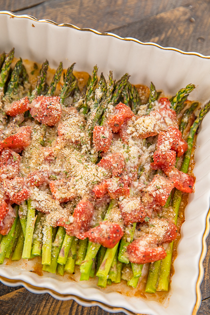 Italian Asparagus - our favorite asparagus recipe!! Such an easy side dish!! Fresh asparagus, diced Italian tomatoes, garlic salt, pepper, Italian seasoning, parmesan and bread crumbs. SO easy! Ready to eat in under 30 minutes! Goes with everything - chicken, pork, steak, casseroles, pasta. Great for an easy weeknight side dish, cookouts and dinner parties. SO good! #asparagus #sidedish #vegetable Italian Asparagus - our favorite asparagus recipe!! Such an easy side dish!! Fresh asparagus, diced Italian tomatoes, garlic salt, pepper, Italian seasoning, parmesan and bread crumbs. SO easy! Ready to eat in under 30 minutes! Goes with everything - chicken, pork, steak, casseroles, pasta. Great for an easy weeknight side dish, cookouts and dinner parties. SO good! #asparagus #sidedish #vegetable