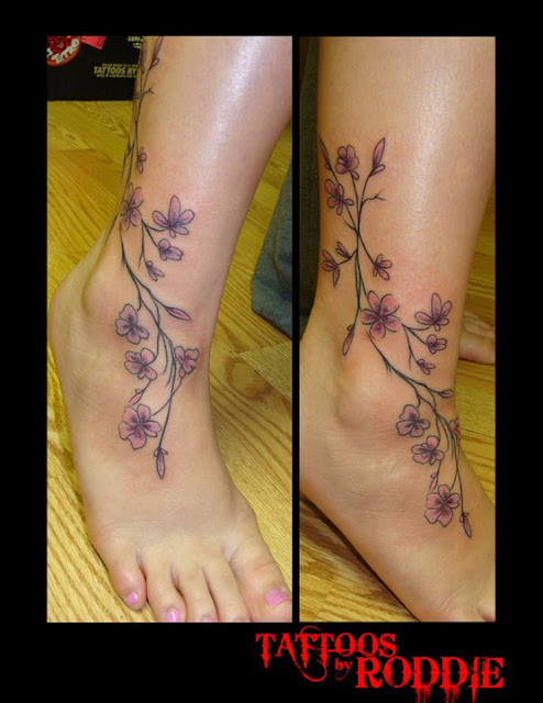 pink flower vine tattoo