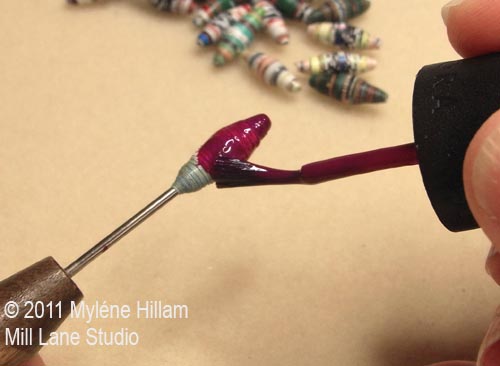 Coating a handmade paper bead with nail polish