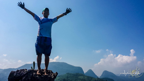 Hiker on top of mountain Yodi freedom shot on top of Mt. Sipit Ulang