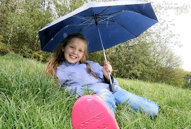 girl rain umbrella outside april showers fun