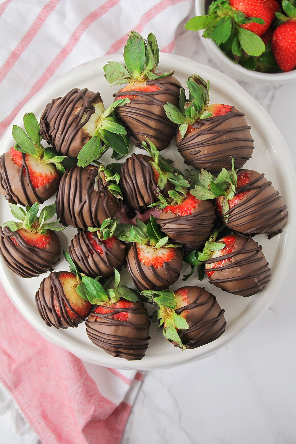 These homemade chocolate covered strawberries are so easy to make and so delicious! They're the perfect romantic dessert for Valentine's Day!