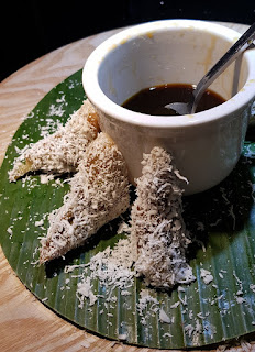 Some of the kueh-kueh (snacks) at the buffet. This coconut-covered kueh is eaten with gula melaka (coconut sugar syrup).