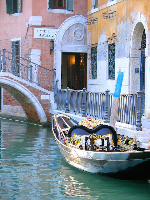 One of Venice's iconic gondolas docks alongside the tiny fondamenta that leads from the entrance of our Hotel Palazzo Priuli to our room to the right in this picture. Note the name of the bridge that led us to our hotel.