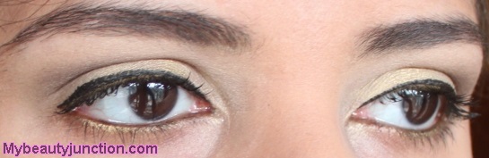 Pale gold eye makeup look with Balm Voyage palette