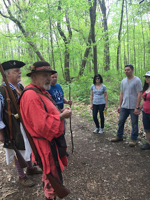 Visitors exploring woods at Bushy Run during spring nature walk Visitors exploring woods at Bushy Run during spring nature walk