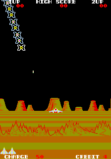 Captura de pantalla de Exerion (Jaleco, 83). La imagen muestra una oleada de enemigos en forma de "lazos" o pajaritas geométricas