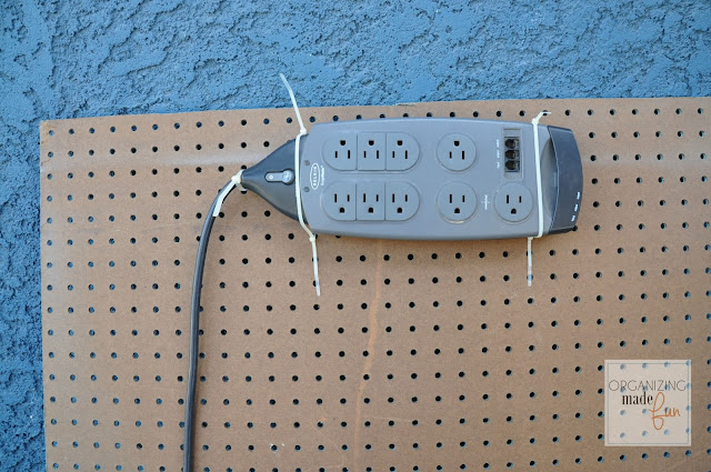 On back of pegboard tie power strip with cable ties :: OrganizingMadeFun.com
