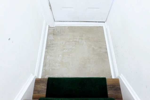 concrete floor covering tile after