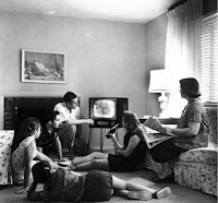 Typical American family from the 50s in front of television set