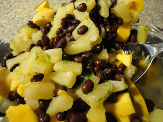 mango, pineapple and black bean salsa. Served over Tilapia with a side of brown rice. Get the recipe on basilmomma.com