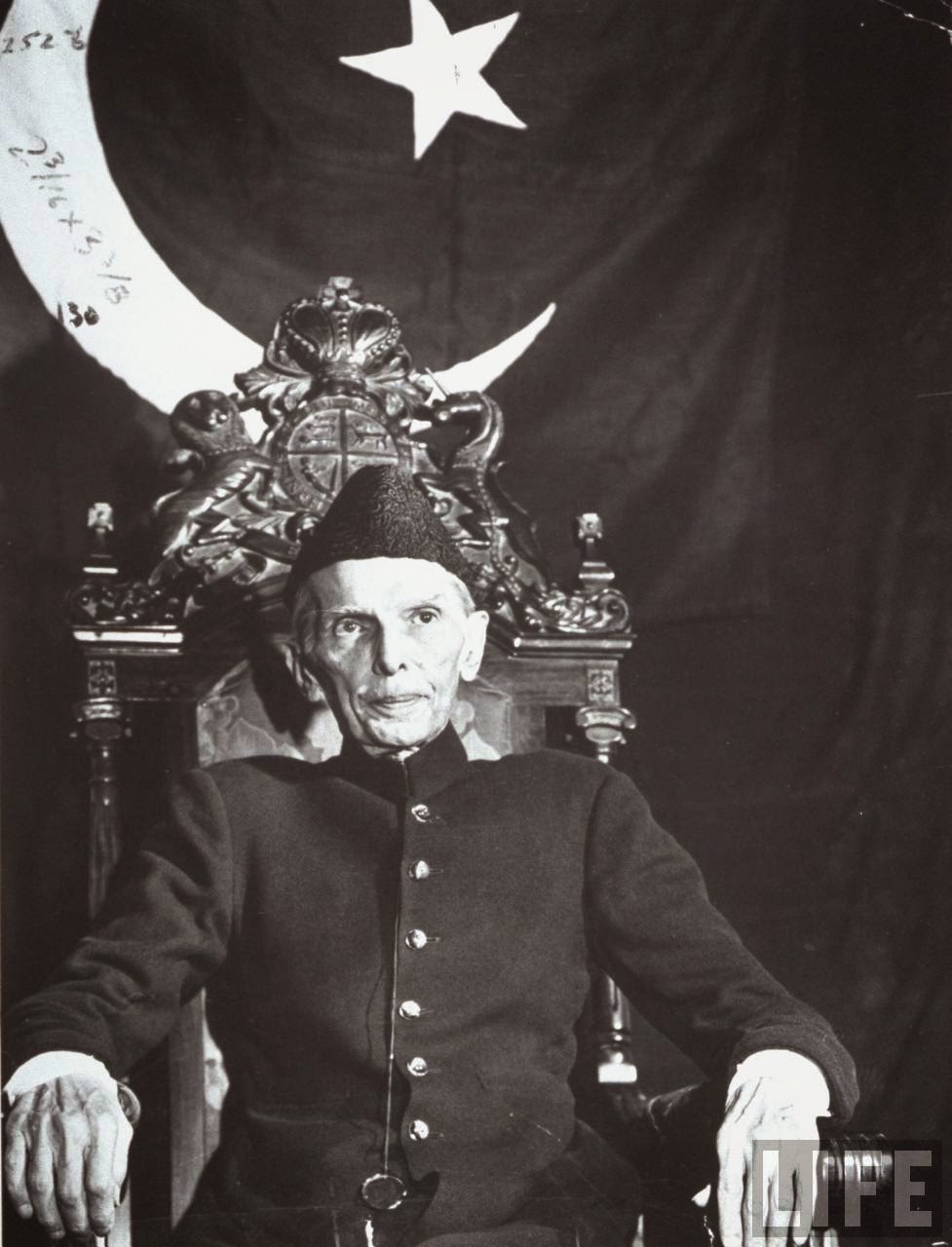 First Governor-General of Pakistan Muhammad Ali Jinnah Sitting in Front of Pakistani Flag - December 1947