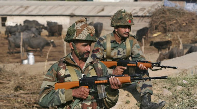 Indian army soldiers stand guard near the Indian Air Force (IAF) base at Pathankot in Punjab, India, January 3, 2016. A gold medal-winning Indian shooter was among 10 people killed in an audacious pre-dawn assault on the air force base, officials said on Sunday as troops worked to clear the compound near India's border with Pakistan after a 15-hour gunbattle. Source: REUTERS/Mukesh
