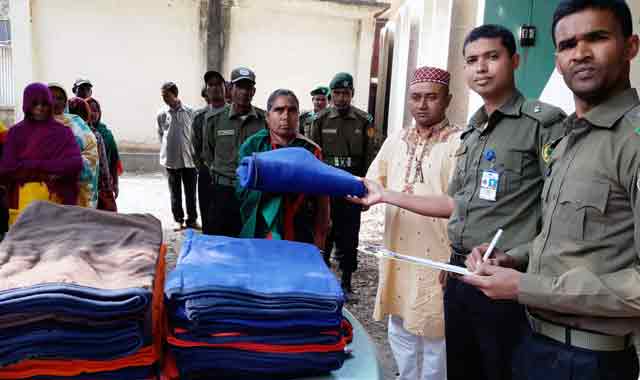 "Delivering warm clothes for Ansar-VDP initiative at Phulbari and Kulaghat" “ফুলবাড়ী ও কুলাঘাটে আনসার-ভিডিপি উদ্যোগে শীতবস্ত্র বিতরণ”