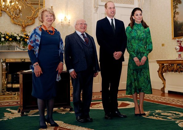 Kate Middleton wore a new silk peplum dress by Alessandra Rich, and Catherine Walker coat. Michael Higgins and Sabina Coyne
