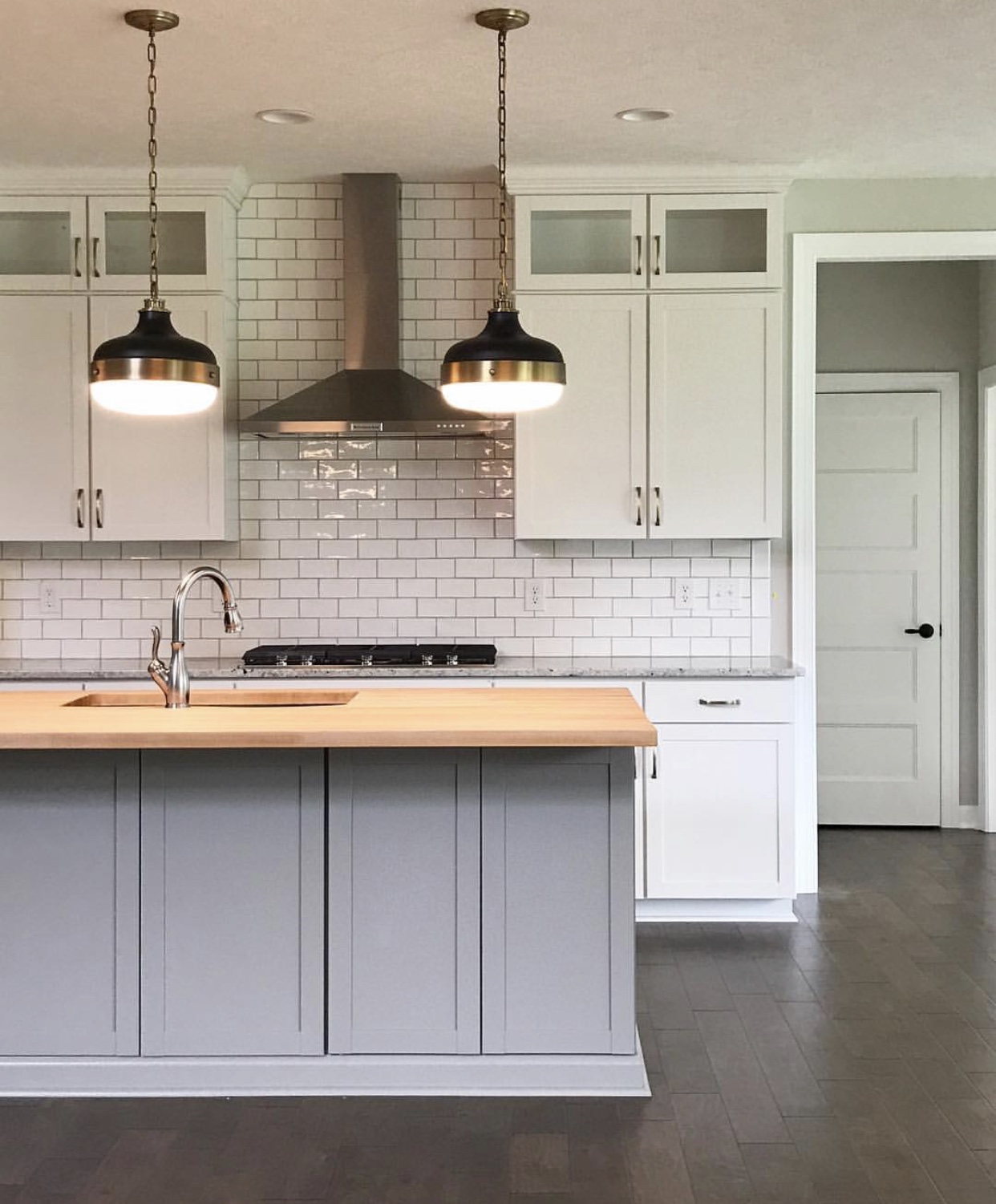 White wavy subway tile with gray grout