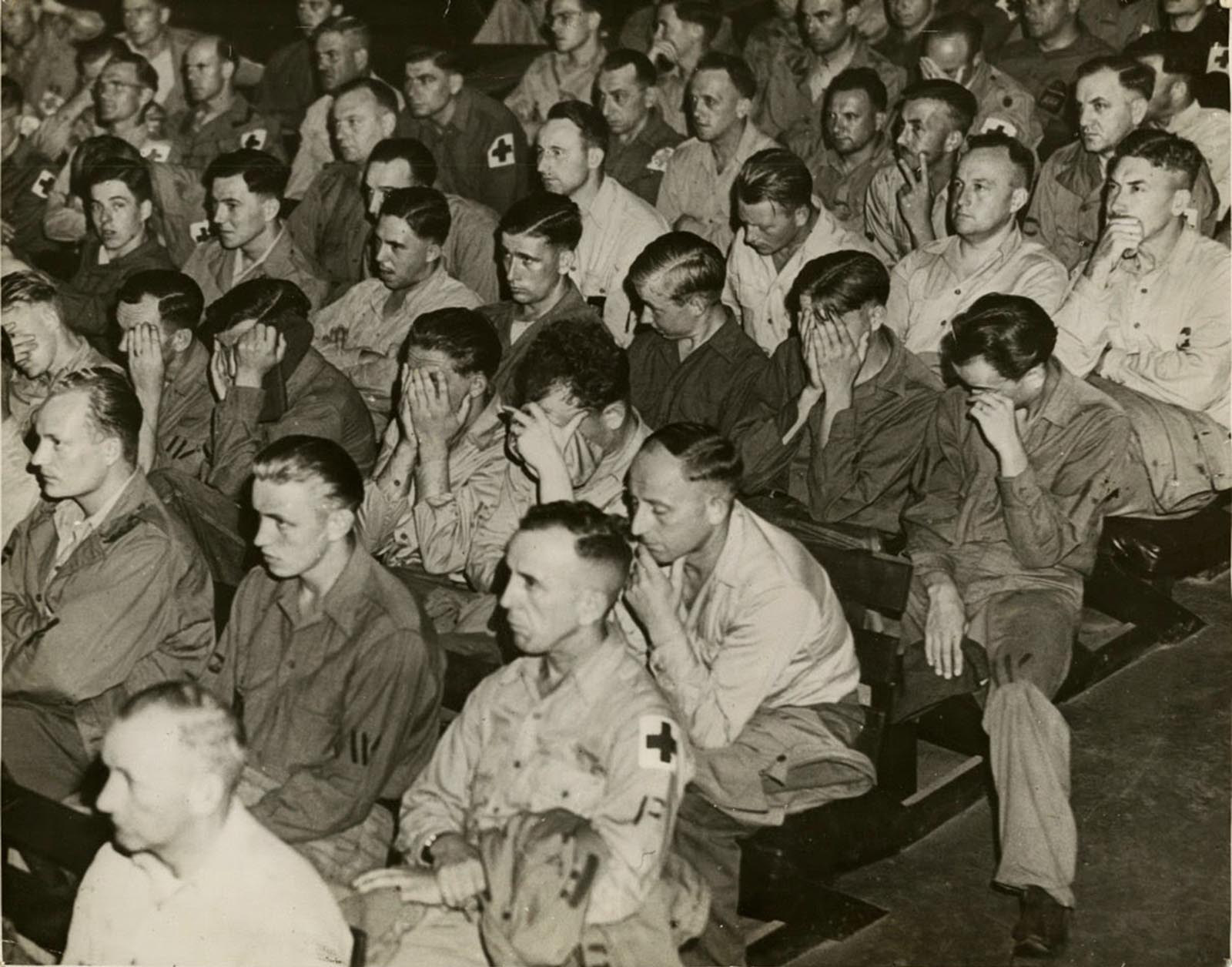 Force confrontation: German soldiers react to footage of concentration camps, 1945.