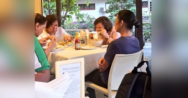 Photo of maid watching while employers eat goes viral
