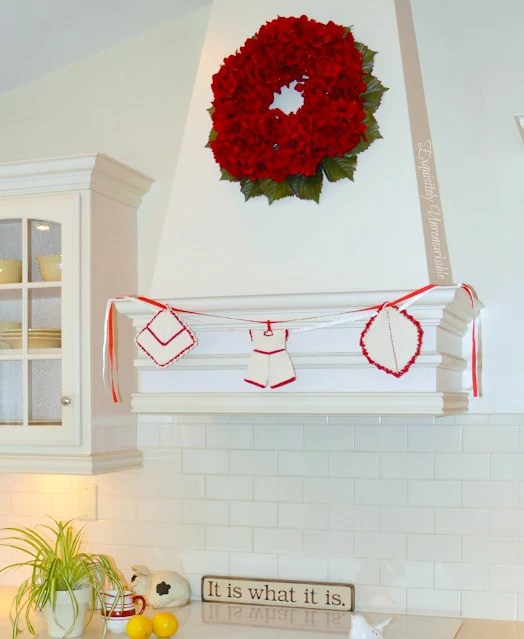 Crocheted Potholder banner hanging on wooden kitchen stove hood