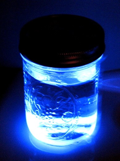 glass jar with glow stick and water inside