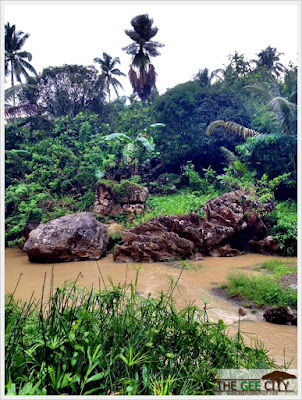 Huge red rock on the river of Brgy. Tabunan