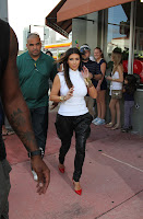 Kim Kardashian in front of  a Motorcycle Store in Miami Beach