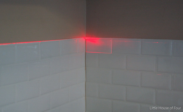 Use a laser level to make sure tiles are level