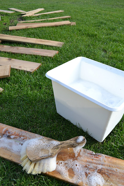 Learn how to clean reclaimed wood and stack it to dry so it doesn't warp.