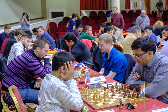 Raunak Sadhwani v Vishy Anand, Alexander Grischuk v Alan Merry Isle of Man Chess International, Round 1, 20 October. Photo by John Saunders Raunak Sadhwani v Vishy Anand, Alexander Grischuk v Alan Merry Isle of Man Chess International, Round 1, 20 October. Photo by John Saunders