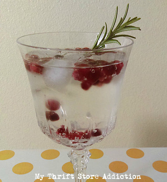 Learn how to make this festive rosemary pomegranate mocktail that can be served at your Valentine's Day table and enjoyed again as the weather gets warmer! refreshing rosemary pomegranate mocktail