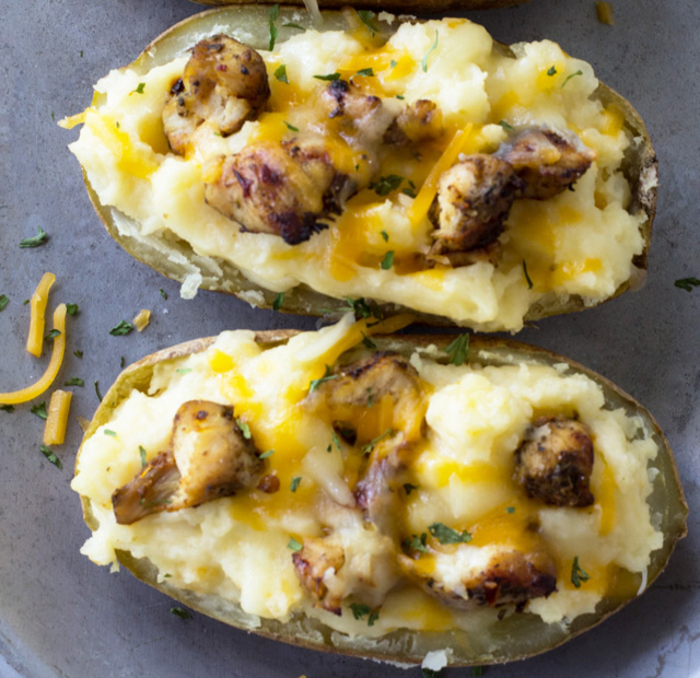 A recipe for the traditional comfort food of twice baked potatoes, with an added touch of jerk chicken.