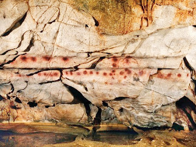 red dots castillo cave Spain