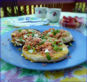 Loaded Egg in a Bagel Basket, an egg cooked in a bagel slice topped with salmon and green onion | Recipe developed by www.BakingInATornado.com | #recipe #breakfast