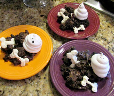 3 dessert plates served with bones, chocolate dirt and meringue ghosts