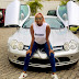 Billionaire Businessman Femi Otedola Reacts As His Daughter Strikes A Pose With His Car