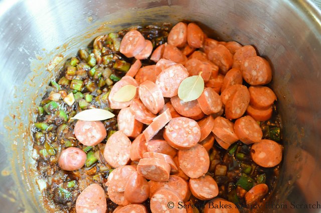 Holy Trinity of bell pepper, onion, garlic, celery, roux with sausage and bay leaves for Shrimp and Sausage Gumbo from Serena Bakes Simply From Scratch.