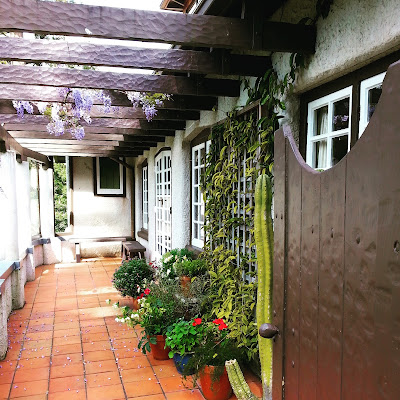 Courtyard of an old arts-and-crafts-style building.