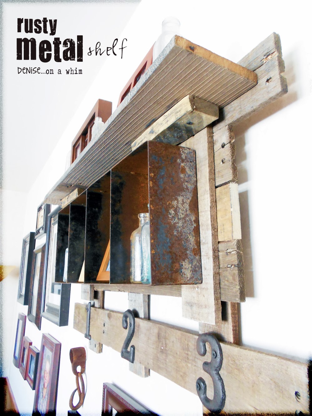 Rustic pallet wood is the perfect backdrop for a rusty bin shelf via http://deniseonawhim.blogspot.com